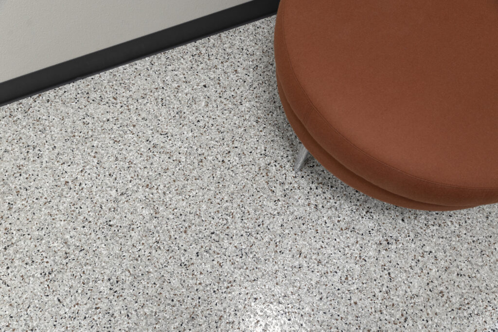 Epoxy floor installation by Prime Concrete Coatings in Kelowna retail space.