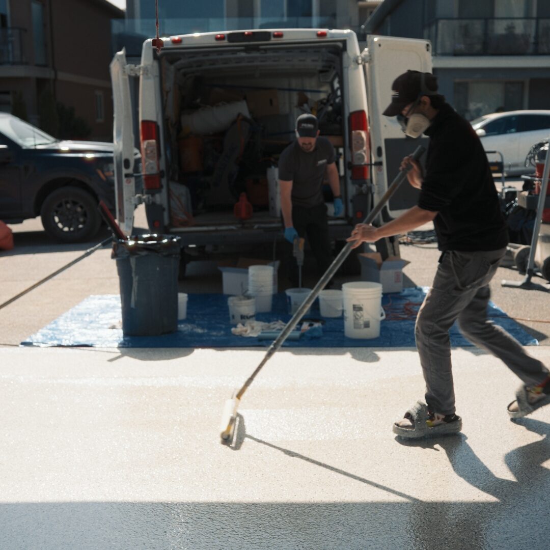 Prime Concrete Coatings installing epoxy flooring system in Okanagan garage